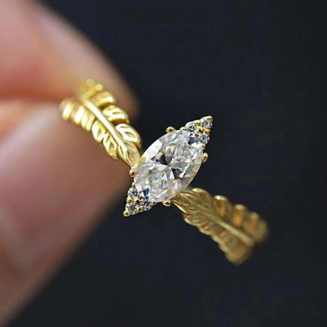 /public/photos/live/Oval Cut Moissanite Feather Style Diamond Ring 537 (1).webp
